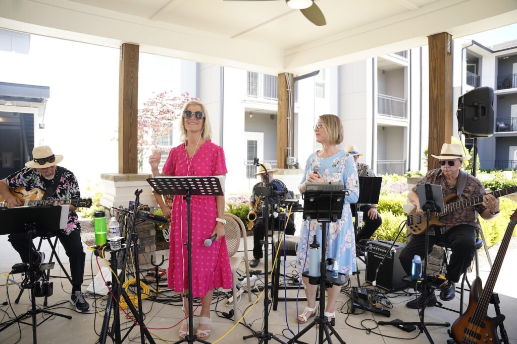 A band plays under a pavilion