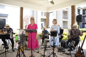 A band plays under a pavilion