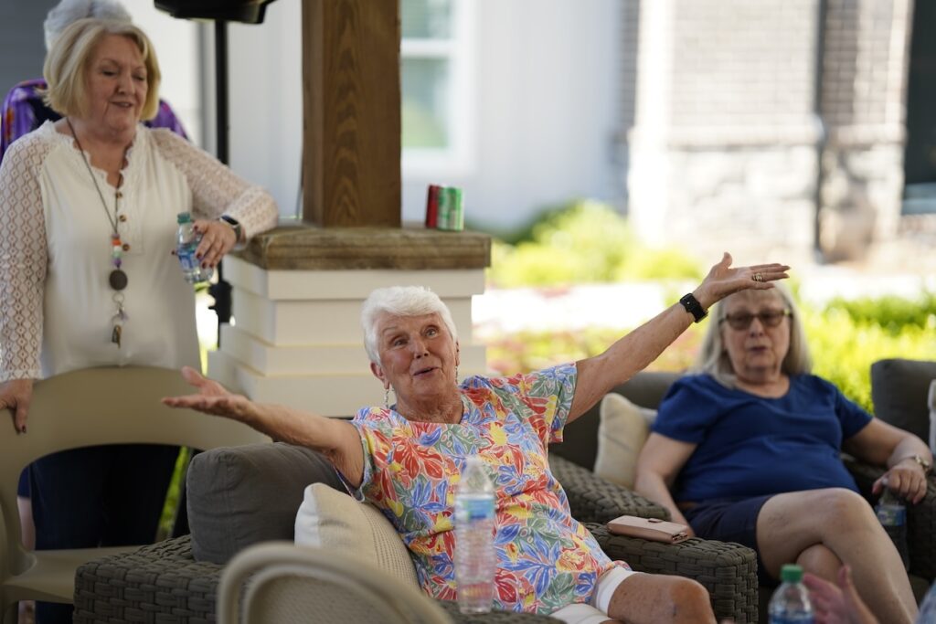 Friends sharing a laugh in the shade
